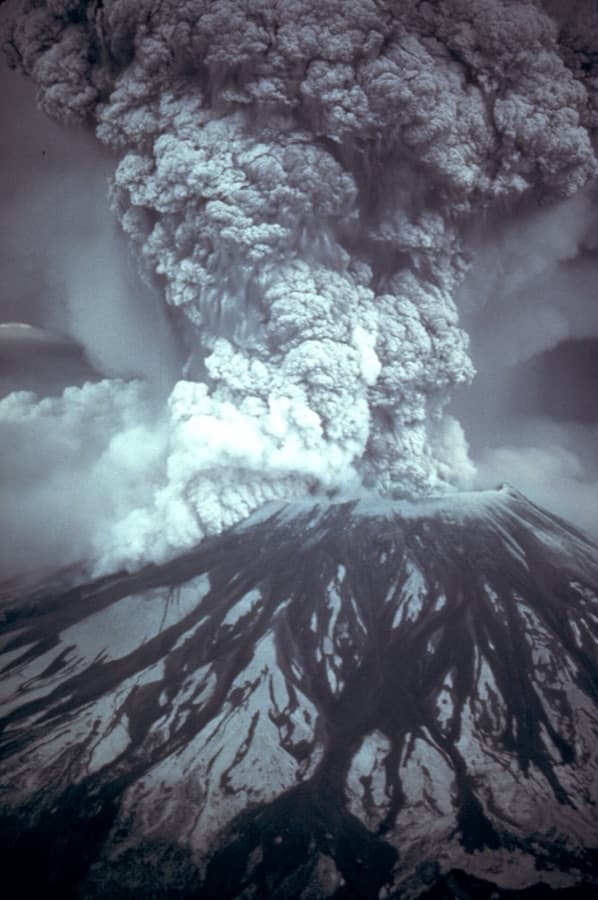 Mount St. Helens erupting on May 18, 1980, with a tall ash column above the summit